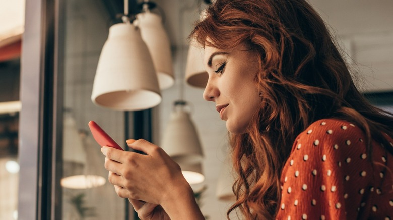 Woman on phone at coffee shop