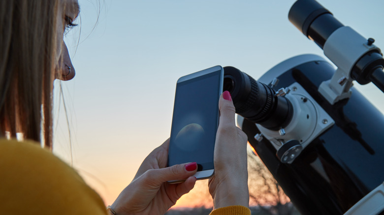 woman looking at moon photo