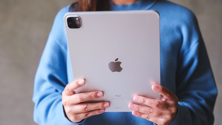 Person holding iPad Pro