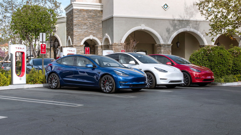 teslas charging at supercharger