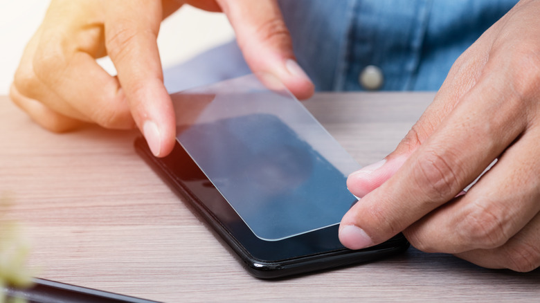 Person applying screen protector