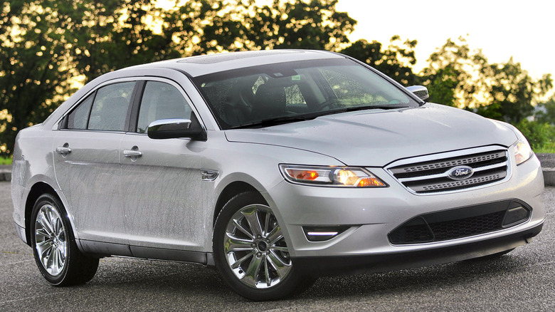 Sliver Ford Taurus parked street