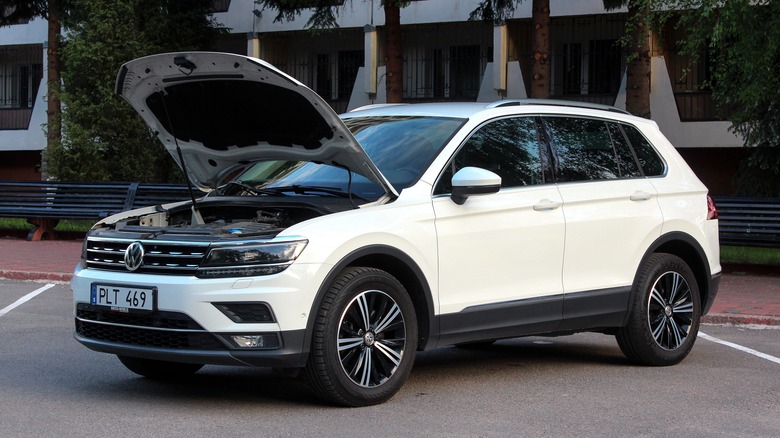 white Volkswagen Tiguan with open hood