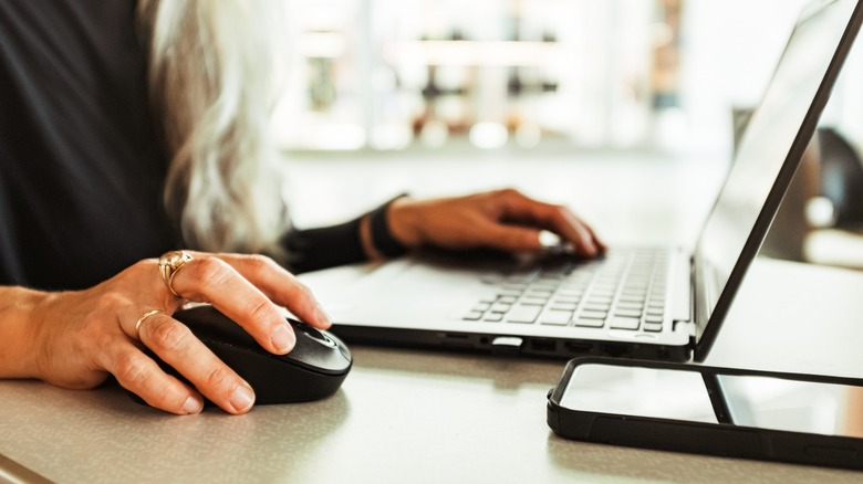 Woman using small wireless mouse